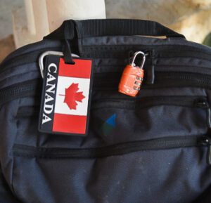 A backpack with a lock and a Canadian ID tag