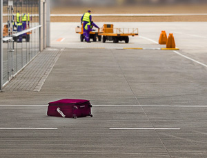 Lost suitcase outside an airport.