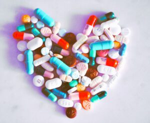 Prescription drugs for travel organized in the shape of a heart