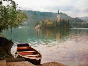 Boat tied in in Lake Bled with view of the church