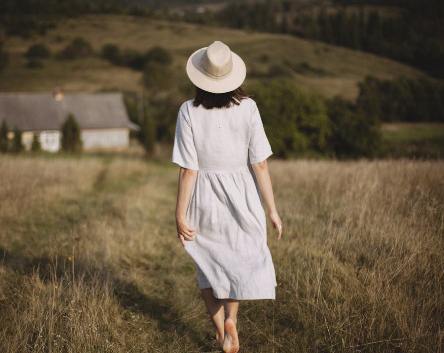 Woman on traveling on vacation in a linen dress