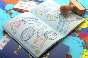 Passport filled with visa stamps from European countries.